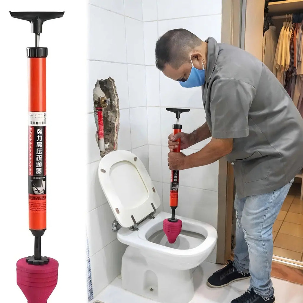 Gasfíter destapando inodoro con bomba 120 PSI